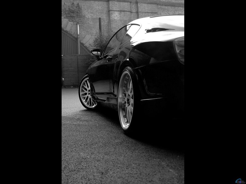 black sports car in grayscale