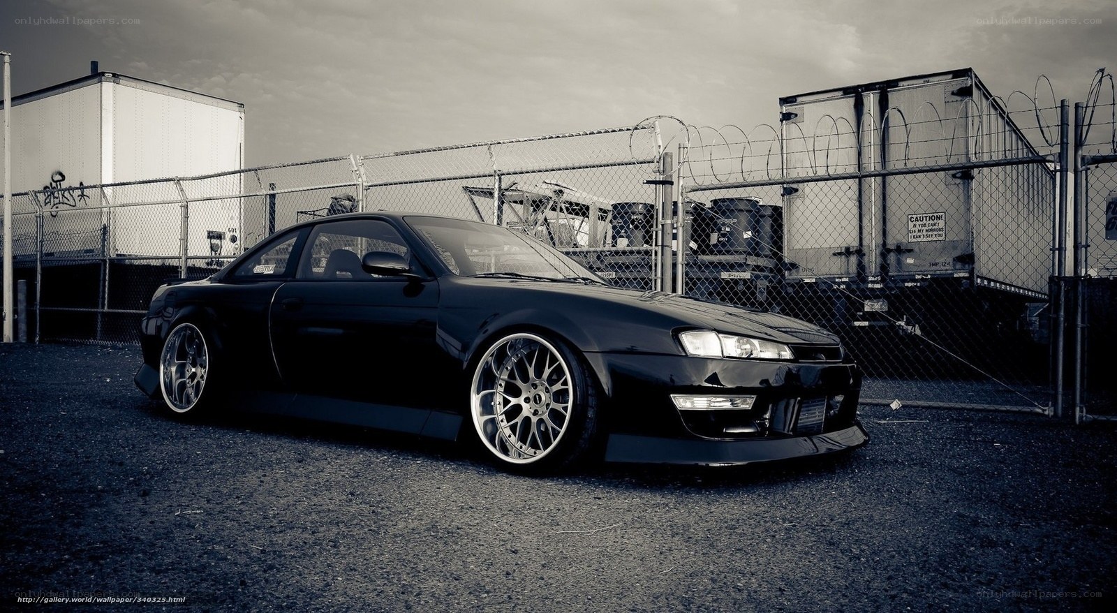 black sports car in industrial area