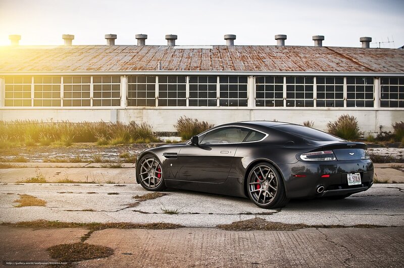 Black sports car in industrial setting