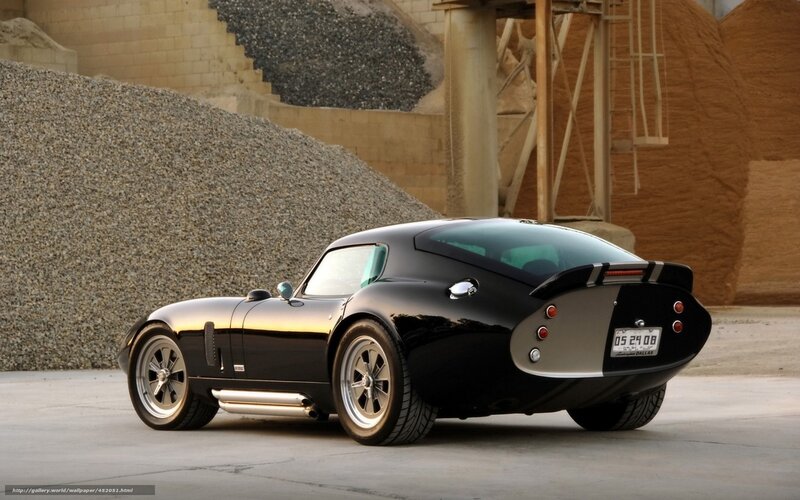 black sports car in industrial setting