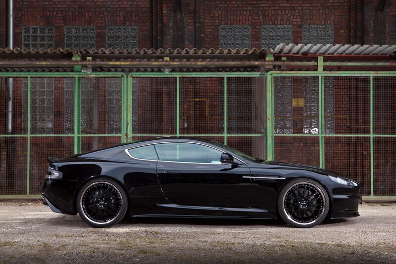 Black sports car in industrial setting