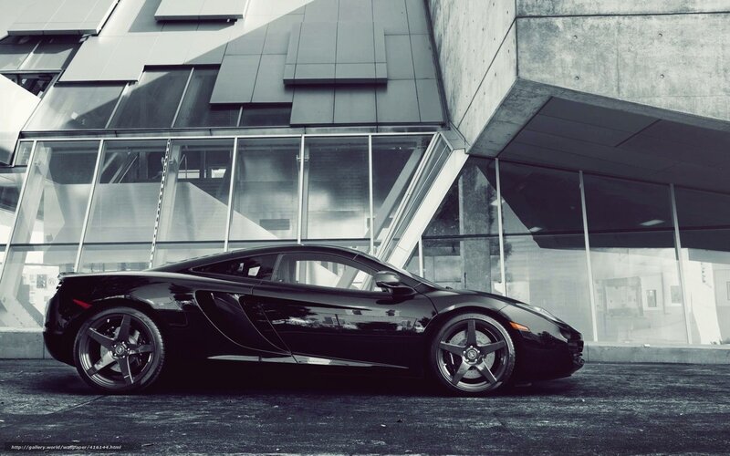 Black sports car in modern city