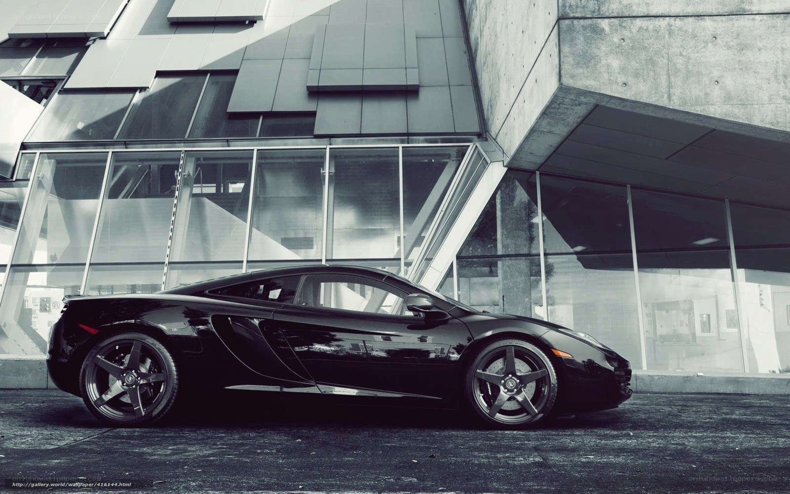 Black sports car in modern city