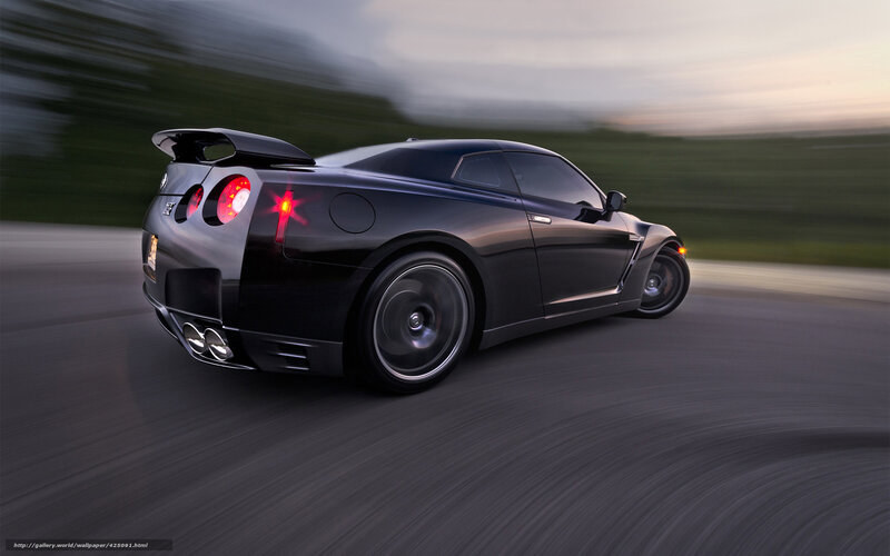 Black sports car in motion