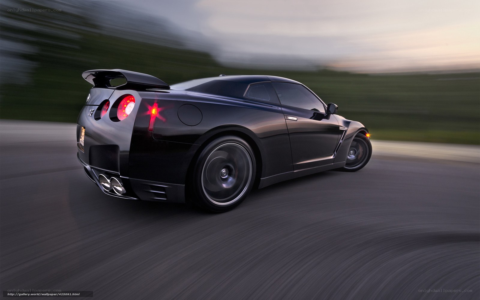 Black sports car in motion
