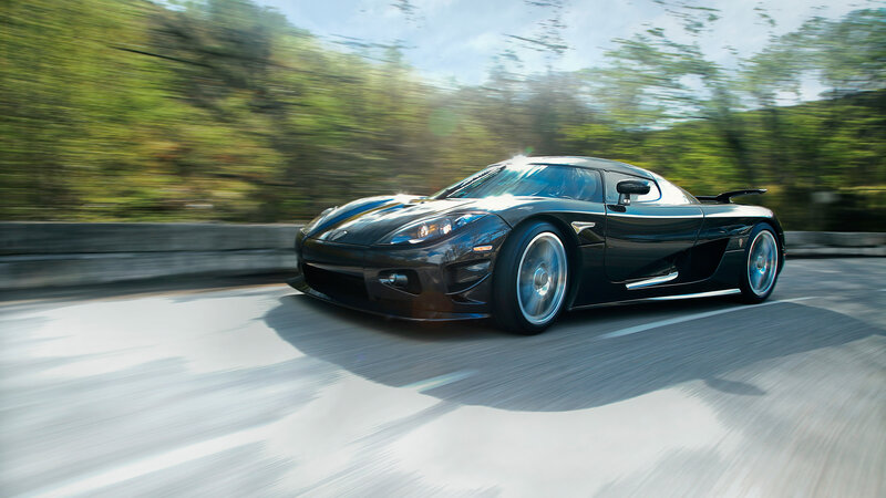 Black sports car in motion