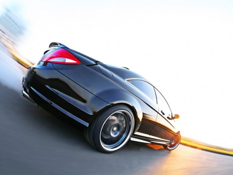 Black sports car in motion