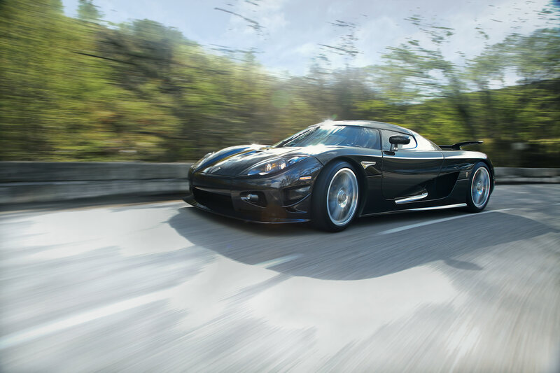 Black sports car in motion