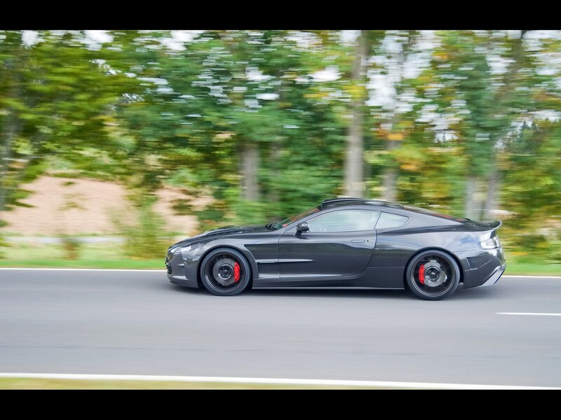 black sports car in motion