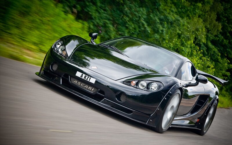 Black sports car in motion