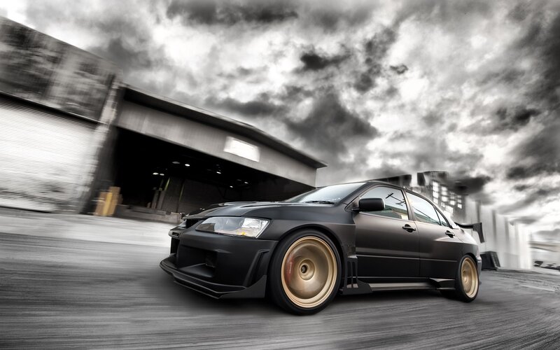Black sports car in motion