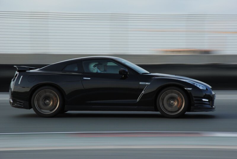 Black sports car in motion
