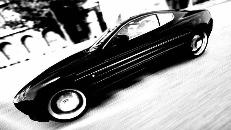 black sports car in motion