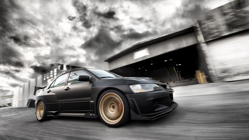 Black sports car in motion