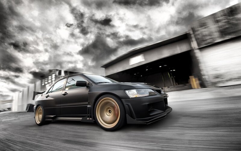 black sports car in motion