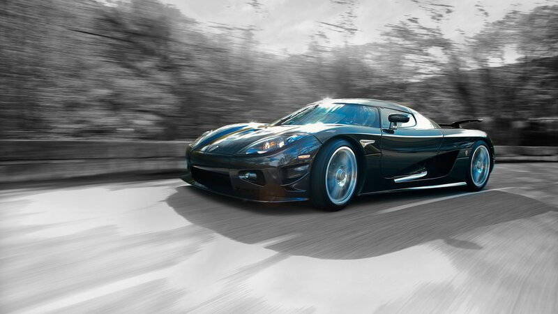 black sports car in motion