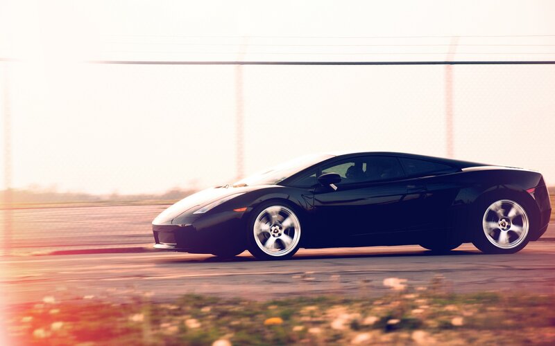 black sports car in motion