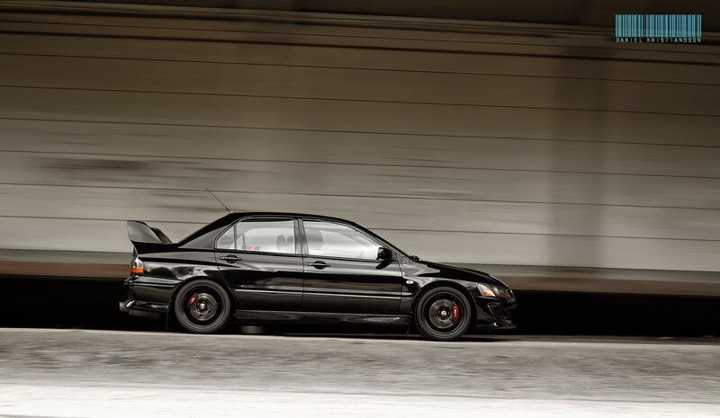 Black sports car in motion