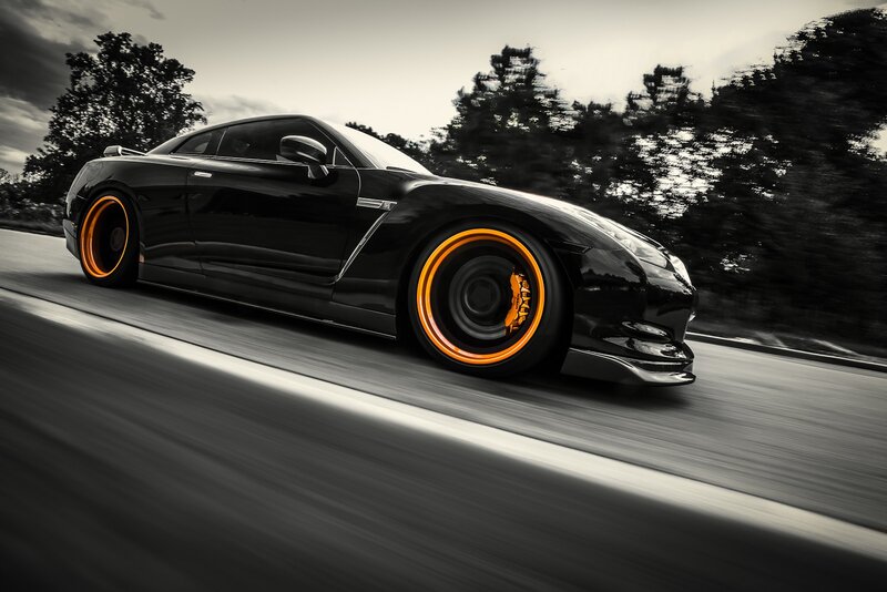 Black sports car in motion