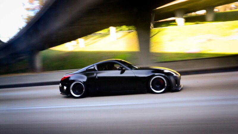 black sports car in motion