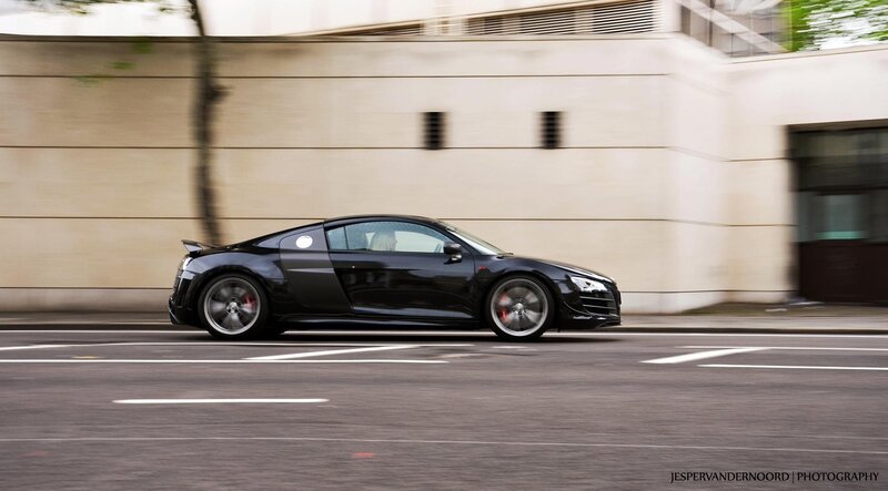 black sports car in motion