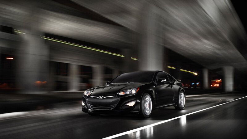 Black sports car in motion