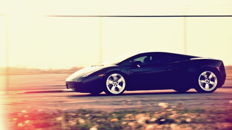 black sports car in motion