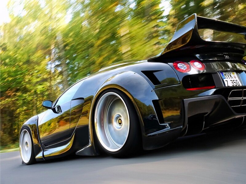 black sports car in motion
