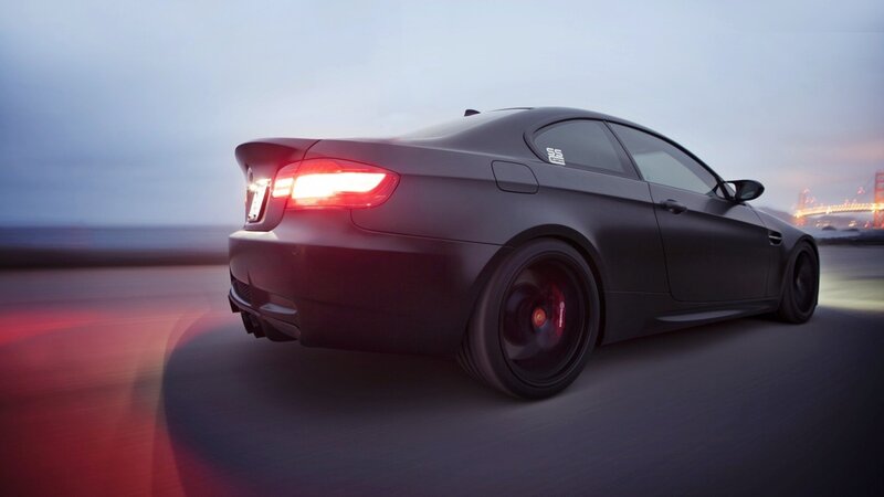 black sports car in motion