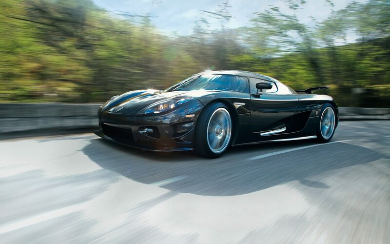 Black sports car in motion
