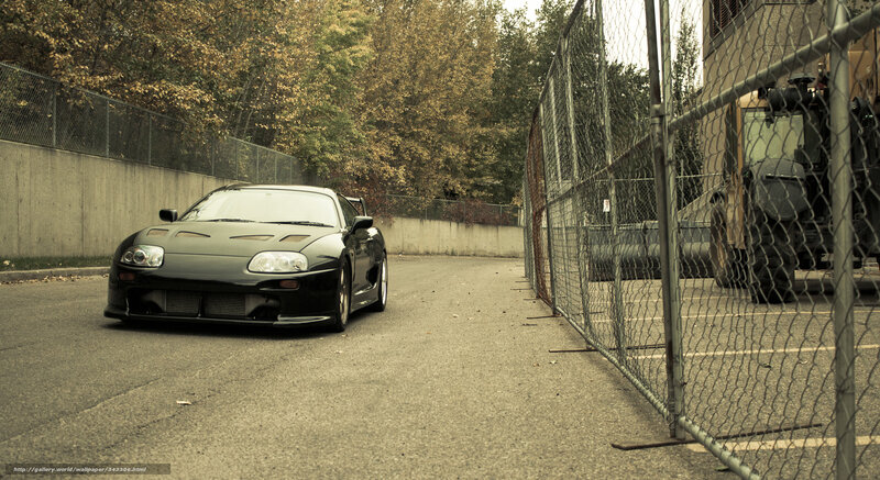 Black sports car in parking lot