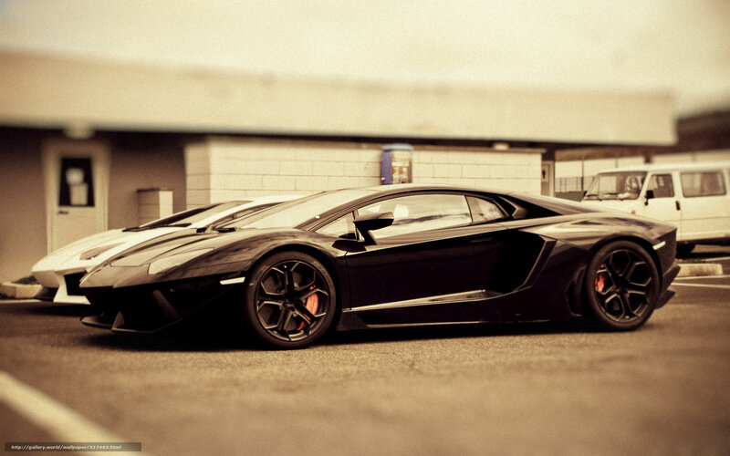 Black sports car in parking lot
