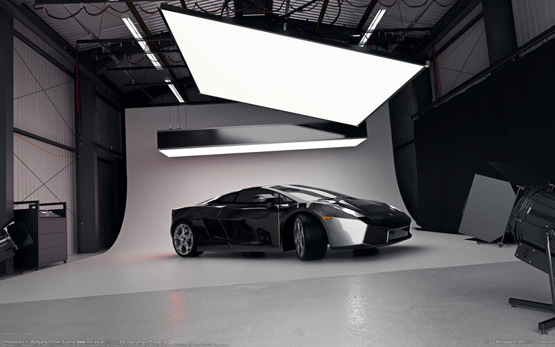 Black sports car in photo studio