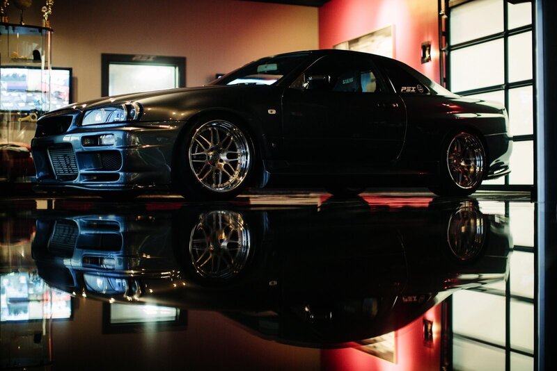 Black sports car in showroom