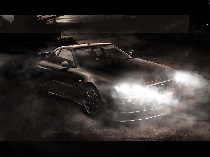 Black sports car in smoke