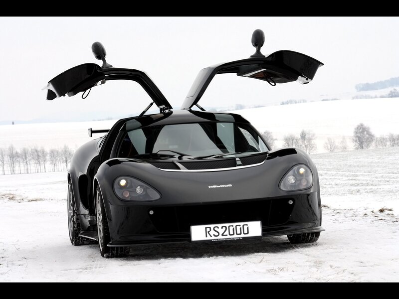 Black sports car in snow