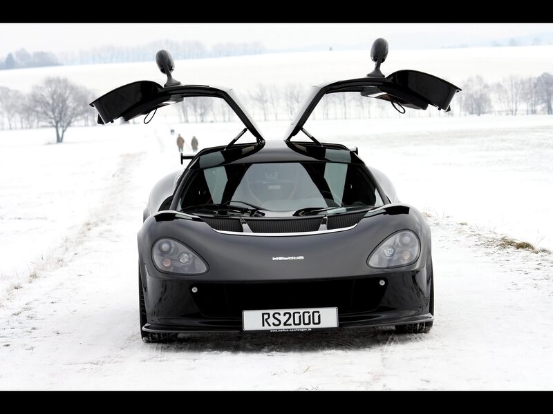 Black sports car in snow