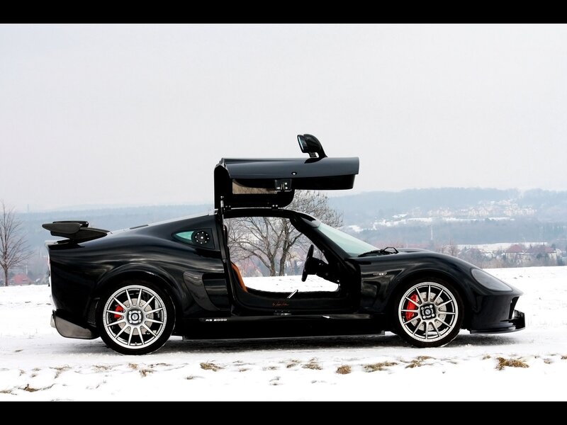 Black sports car in snow