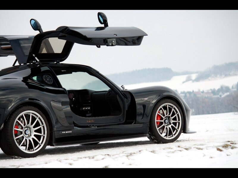 Black sports car in snow