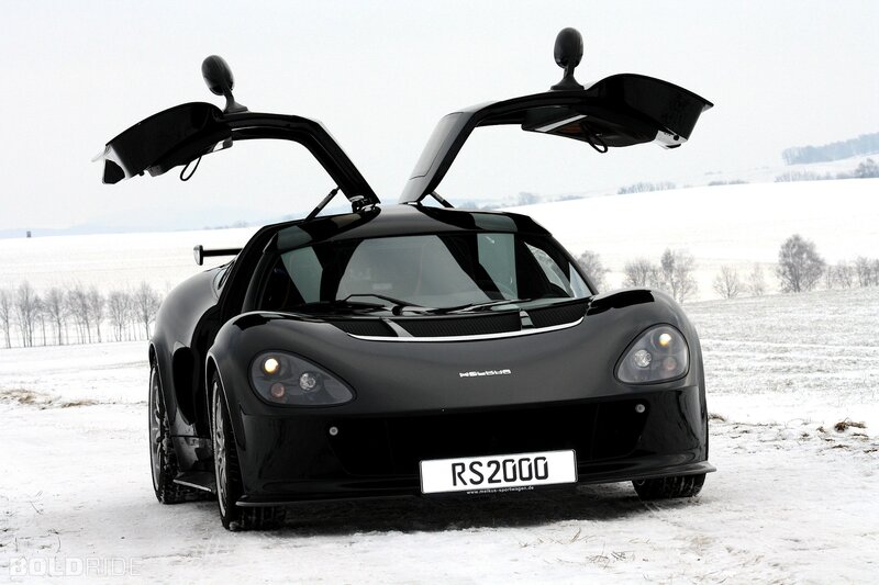 Black sports car in snow