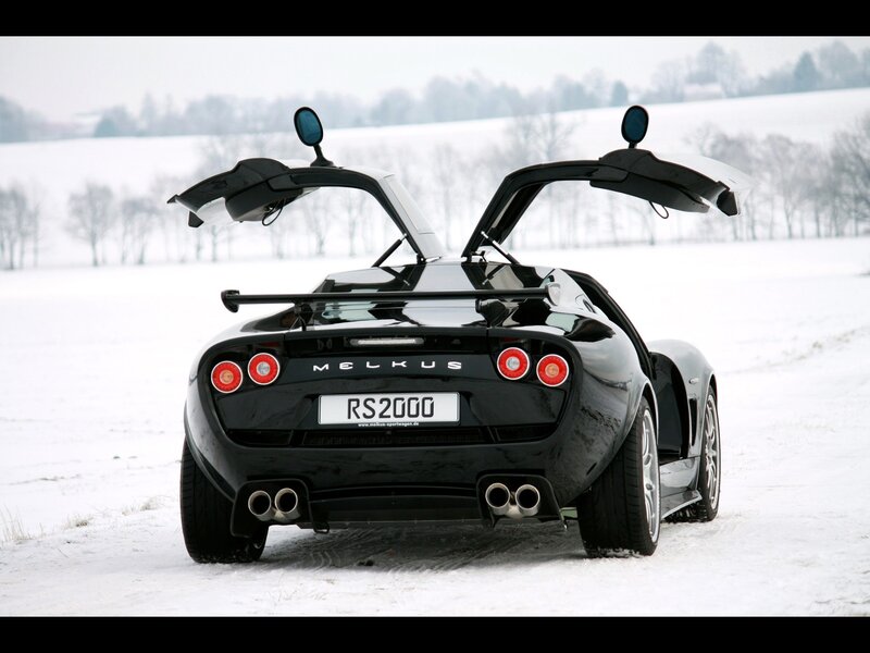 Black Sports Car in Snow — Cold, Winter, Photograph, Trees, Open Doors