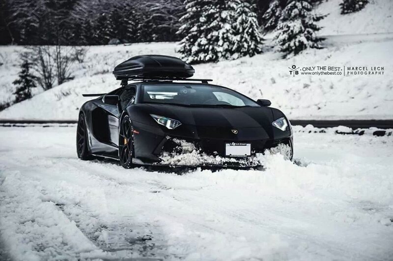 Black Sports Car in Snow — Dramatic