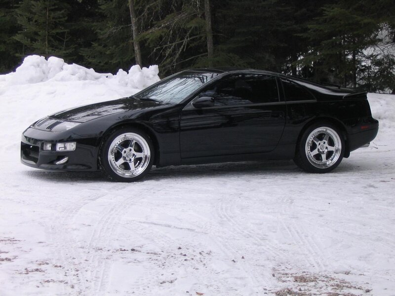 Black sports car in snow