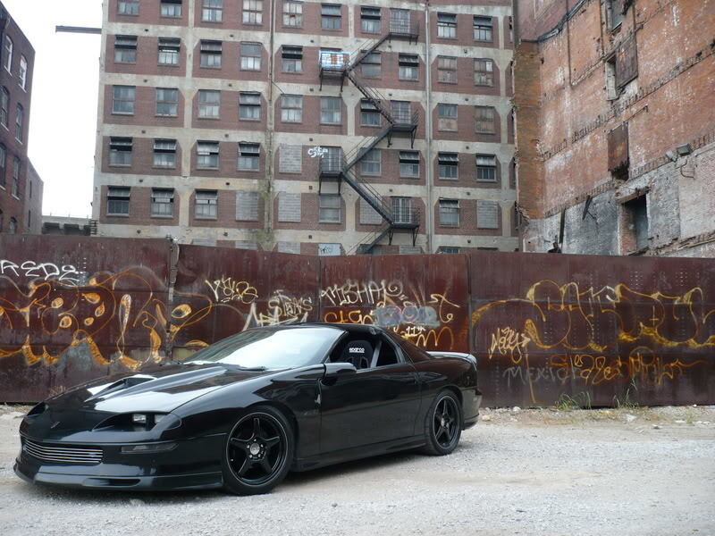 black sports car in urban alley