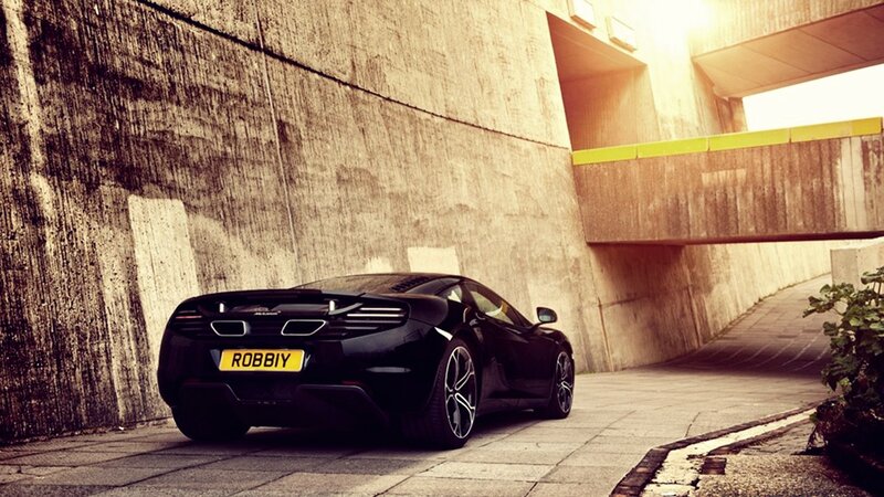 Black sports car in urban alley