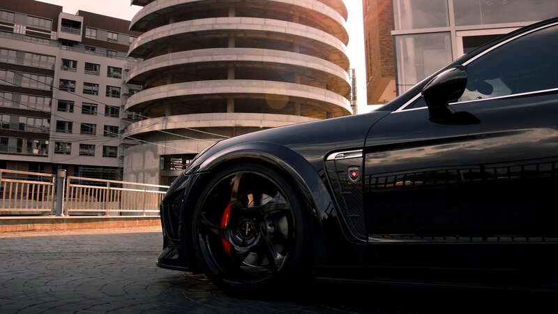 Black sports car in urban setting