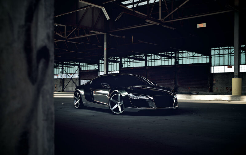 Black sports car in warehouse