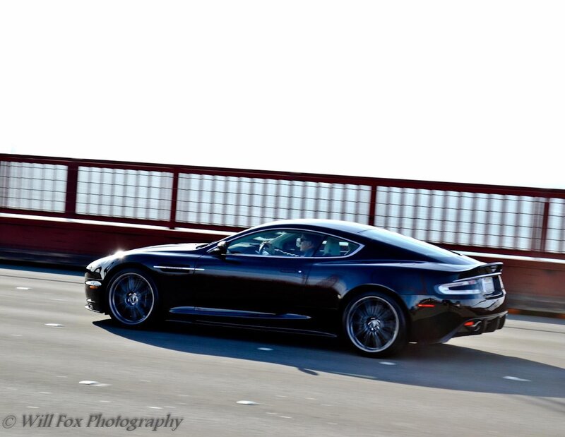 Black sports car on a bridge
