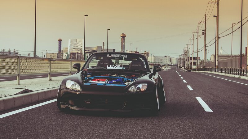 Black sports car on a bridge