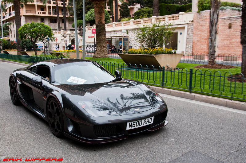 Black sports car on a city street